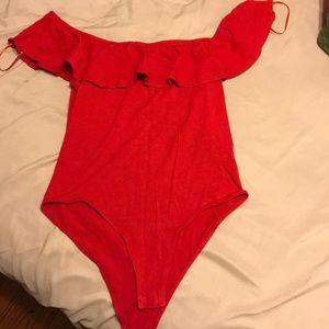 A red bodysuit